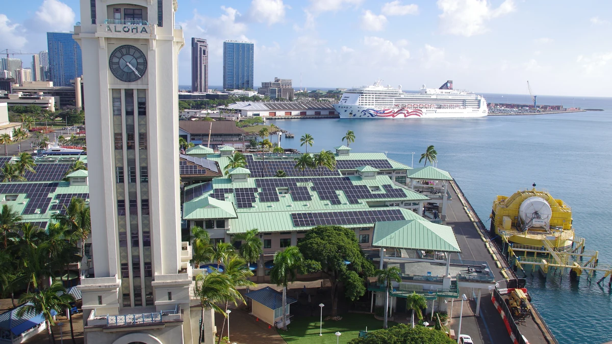 Cruise ship berthed in Honolulu Harbor behind Aloha Tower