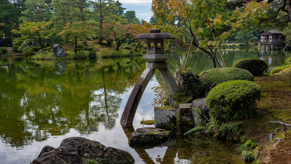 Kenrokuen Garden with stone lantern and pond in Kanazawa, Japan