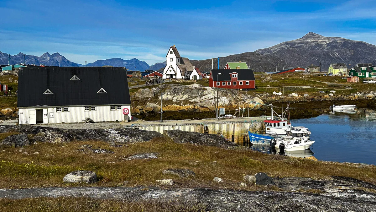 Nanortalik cruise port harbour with colourful houses and mountain scenery
