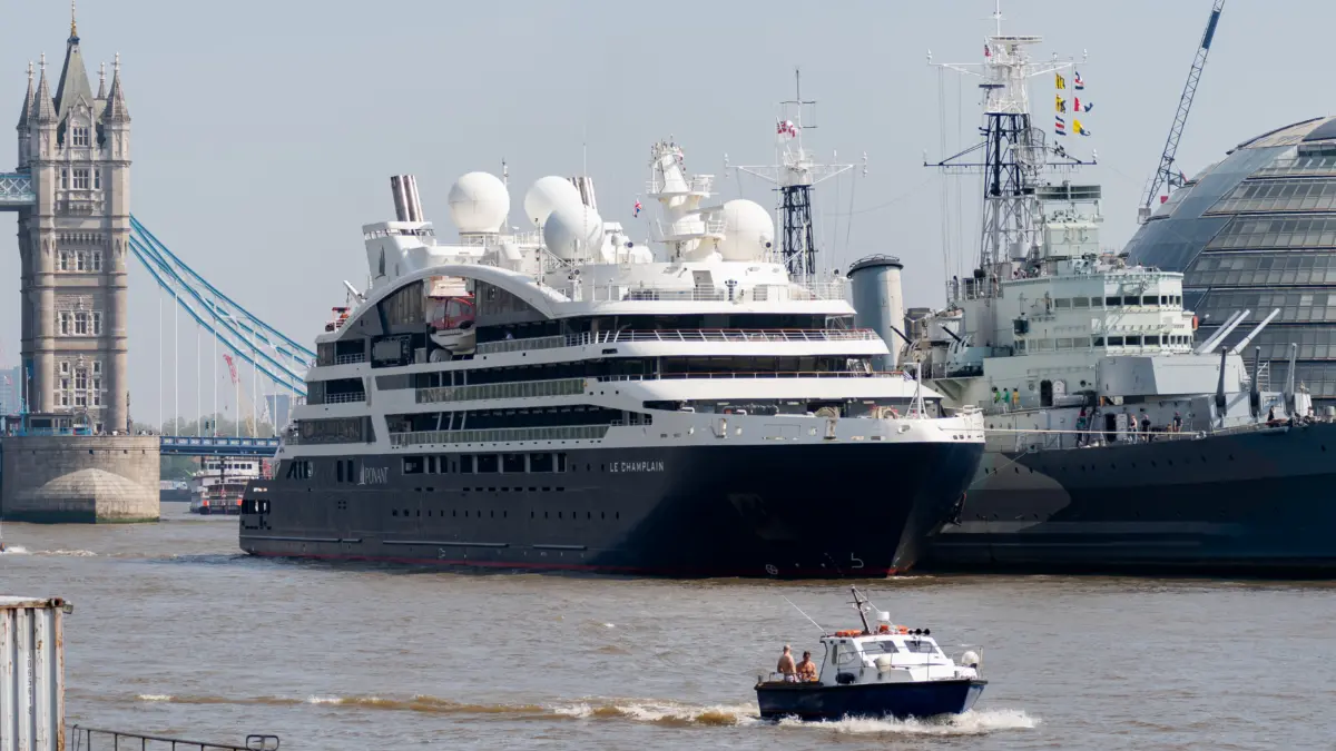 Le Champlain cruise ship alongside HMS Belfast in London