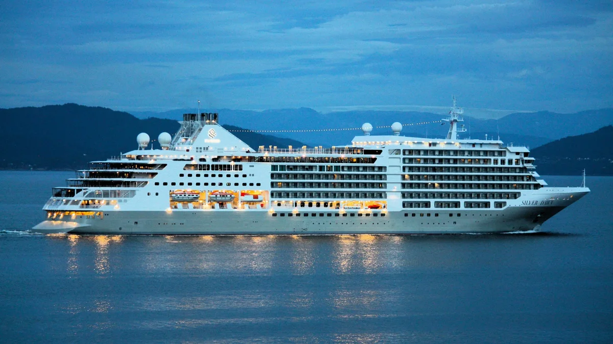 Silver Dawn cruise ship sailing through Korsfjorden Norway